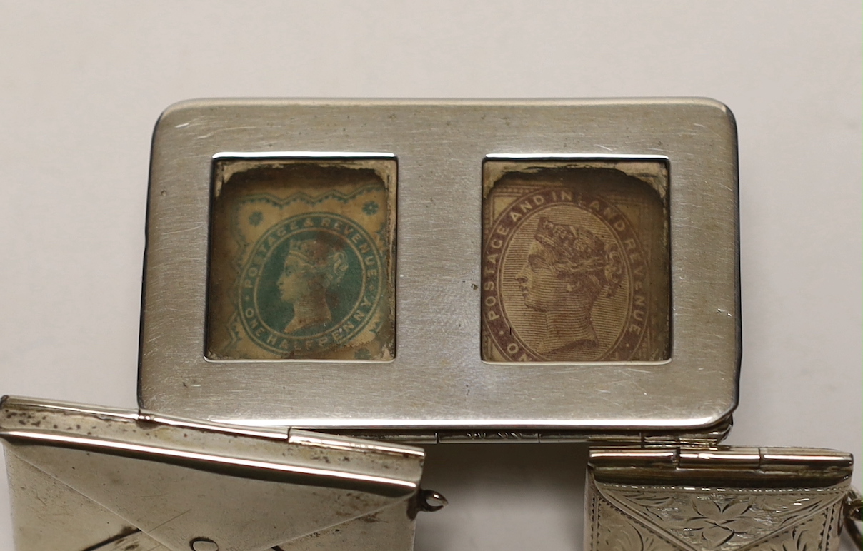 A late Victorian novelty silver double stamp case, modelled as a trough, Levi & Salaman, Birmingham, 1899 and two other silver or 925 'envelope' stamp cases.